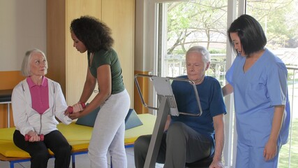 Slow motion of elderly couple training at the gym with weigths