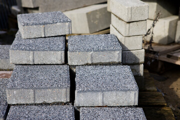 Pavement-Stacks of new concrete paving slabs on wooden pallets
