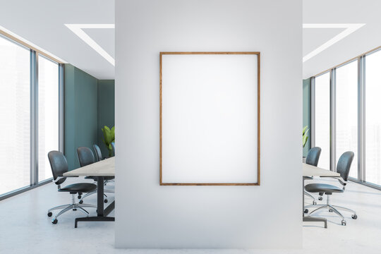 Mockup frame on a wall in office conference room with furniture and windows