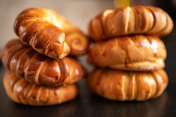 Homemade bagels close-up on a dark wooden background.