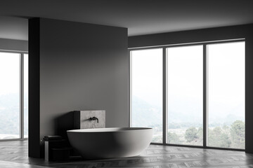 Fototapeta na wymiar Wooden grey bathroom with white bathtub and towels near window