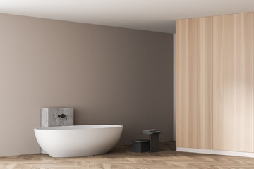 Fototapeta na wymiar Wooden bathroom with white bathtub and towels near drawer