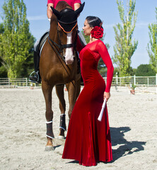 Flamenco dancer with a horse with red dress