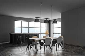 Dark modern dining area with table. Wooden parquet floor. Panoramic window.
