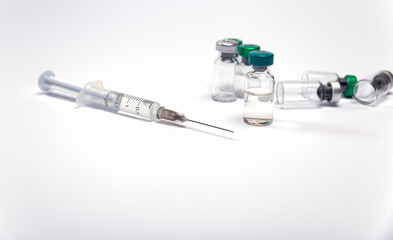 syringe and medicine bottles. Influenza vaccine