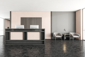 Black and wooden reception room with armchairs near window, desk and computers