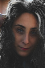 Fototapeta premium portrait of woman with curly hair 