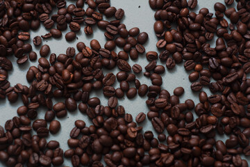 coffee beans lie on the background arabica, robusta