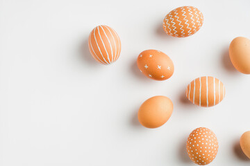 Happy Easter card. Simple painted Easter eggs isolated on white background. Flat lay, top view