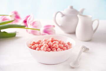 bowl with strawberry sweet corn balls. Delicious and healthy breakfast cereal.