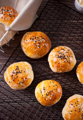 Fresh homemade whole grain burger buns with sesame