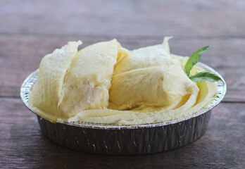 Durian cake on wood table in cafe