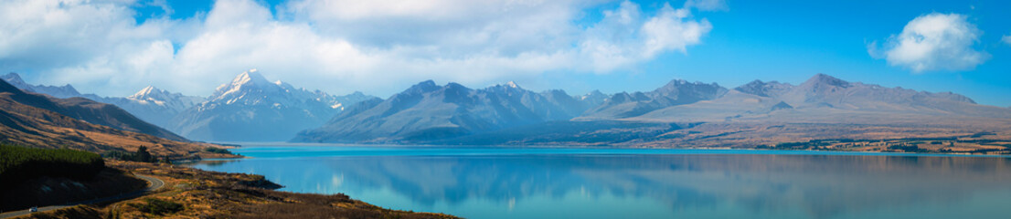 Mount Cook in New Zealand with a lovely blue lake reflecting your travel