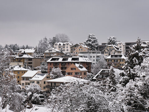 Colorful houses near the city center of Lucerne in a winter environment with snow