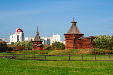 Kolomenskoye Park in Moscow. Museum of Wooden Architecture. The connection of times, ancient architecture against the background of modern residential buildings.