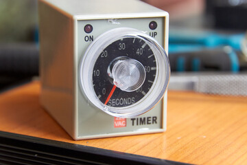 close-up of electrical analog timer for control cabinet