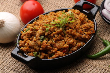 Masala Anda Bhurji or Spicy Indian scrambled eggs with bread or Bun Pav, Popular street food