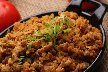 Masala Anda Bhurji or Spicy Indian scrambled eggs with bread or Bun Pav, Popular street food