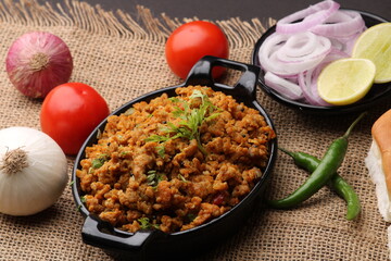 Masala Anda Bhurji or Spicy Indian scrambled eggs with bread or Bun Pav, Popular street food