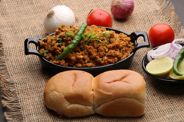 Masala Anda Bhurji or Spicy Indian scrambled eggs with bread or Bun Pav, Popular street food