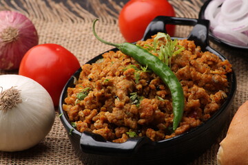 Masala Anda Bhurji or Spicy Indian scrambled eggs with bread or Bun Pav, Popular street food