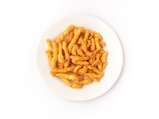 Kurkure  on plate isolated stock image with white background.