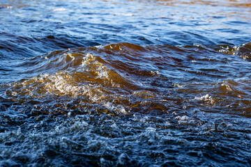 Clear water flowing in the river, abstract water background
