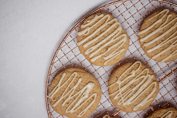 Closeup of spiced cookies with beige maple icing