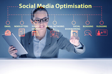 Social media optimisation concept with businesswoman