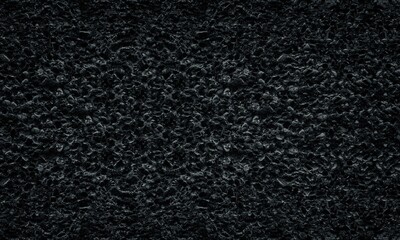 Black rough cement mortar with pebbles texture. Dark gray old weathered concrete wall. Gloomy...