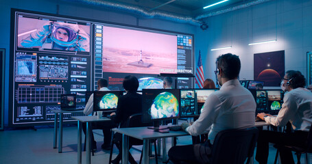 Team watching rocket launch in office