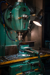 Old drilling machine in the workshop