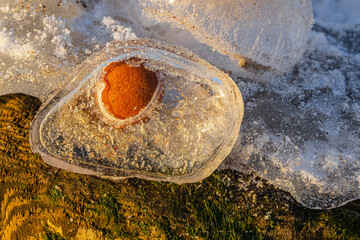 pebbles are frosted at the sea