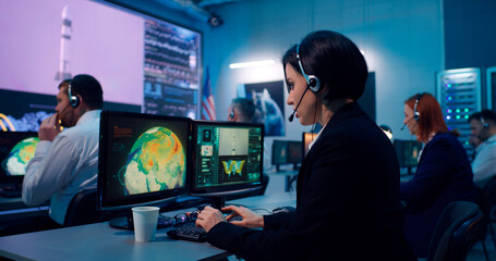 Flight operator using computer during spacecraft launch