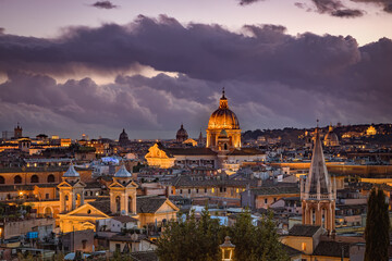 Evening view of the Roman rooftops from from the public park Pincian Hill, Villa Borghese gardens, Rome, Italy