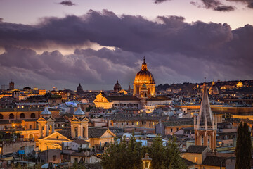 Fototapeta premium Evening view of the Roman rooftops from from the public park Pincian Hill, Villa Borghese gardens, Rome, Italy