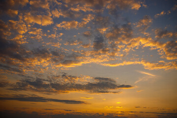 Beautiful orange sky with clouds background.