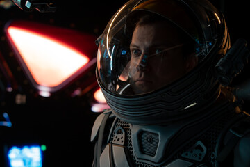Portrait of Caucasian male astronaut inside spaceship cockpit. Sci-fi space exploration concept....