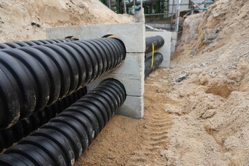 Flexible Conduit is placed underground to be used to trace high voltage cables in the construction...
