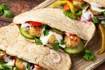 Vegetarian Chickpea falafel pita bread with pickled chilies and fresh salad. healthy vegan food.