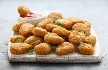 Crispy Jalapeno Popper with creamy cheese battered on white wooden board