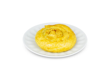 Spiral puff pastry bun on white porcelain saucer, isolated on white background