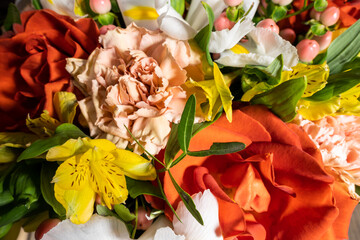 Basket of fresh flowers consisting of Rose Carnation Iris Alstroemeria Hypericum and pistachio