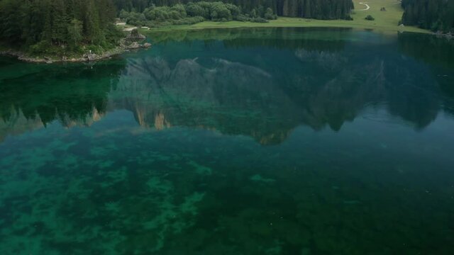 Alpine lake lago di fusine in Italy. Aerial view shot with drone.