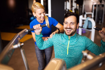 Group of fit people in gym training. Multiracial group of friends working out together