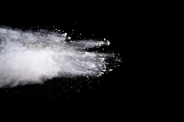 Explosion of white powder isolated on black background. Abstract colored background. holi festival.