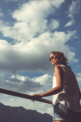 Portrait of a pretty, young woman outdoors in warm evening sunlight