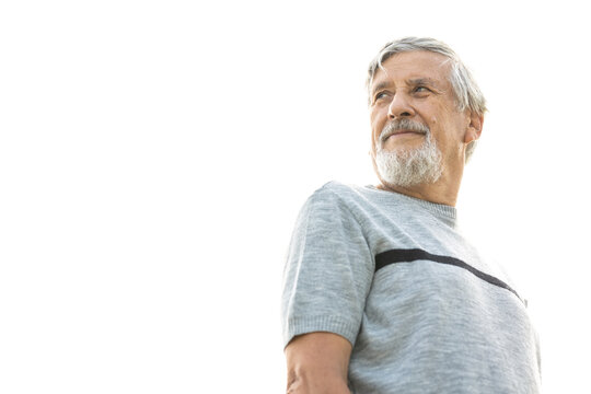 Happy Senior Man Outdoors Against The Sky On A Warm Summer Day