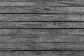 Texture of rural stained exterior brushed oak planks of country shed. Old dirty rough siding of gnarled surface wooden paneling. Rustic veined facing lumber fence of hard boards for 3D style design
