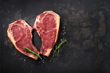 Heart shape raw dry aged beef rib steaks (cote de boeuf)